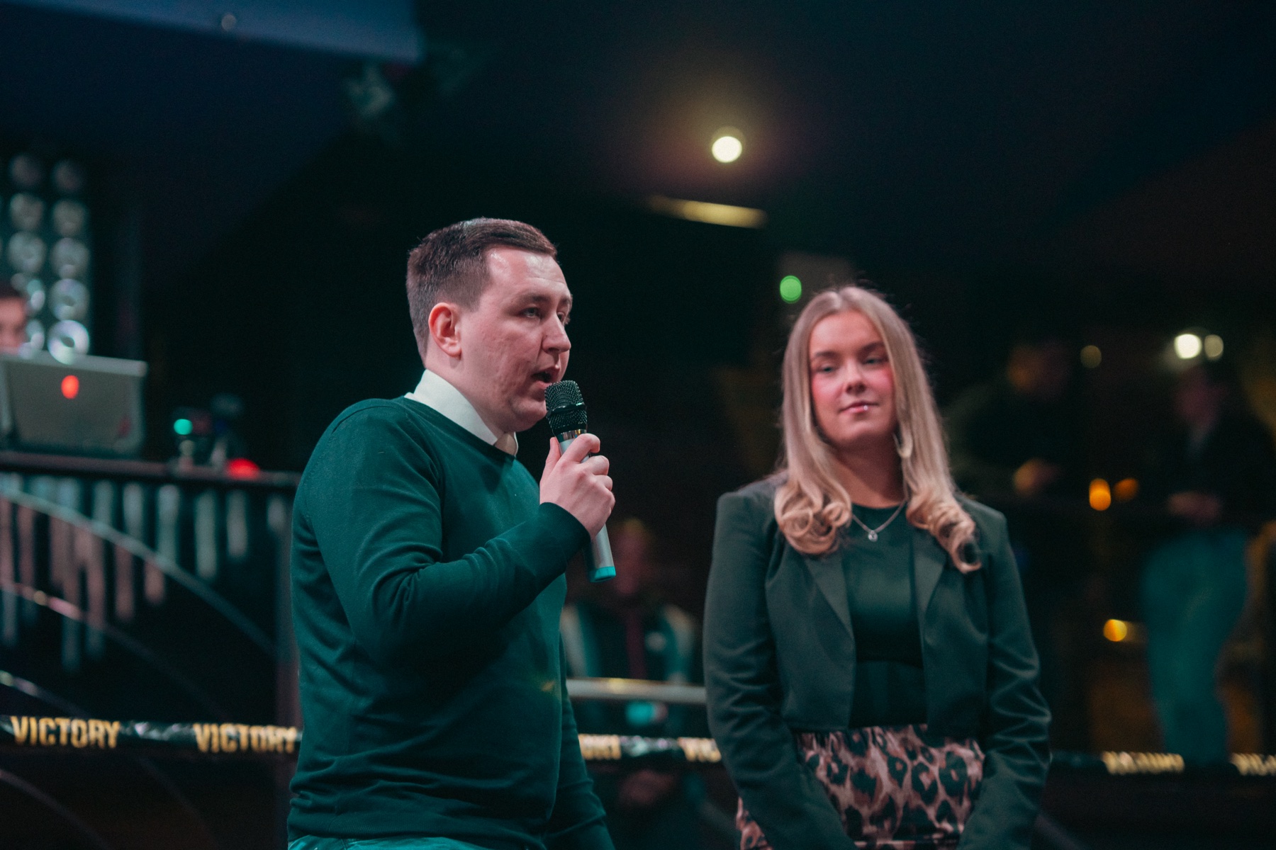 Speaker addressing the Industry Rumble crowd from the ring